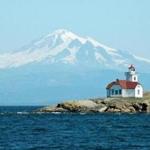 The Patos Island Lighthouse in front of Mt. Baker in Washington's San Juan Islands.; Shutterstock ID 97761230; PO: 4/19 TRAVEL